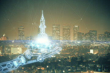Double exposure of start up theme drawings over cityscape background. Concept of success.