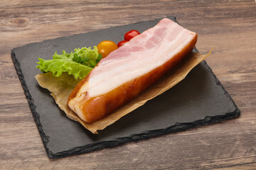 Smoked pork breast with salad leaves
