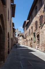 Fototapeta na wymiar street in the town of San Gimignano with its towers during the lockdown for COVID-19