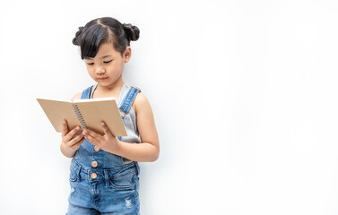 Portrait of little cute asian toddler girl reading book isolated on white background, Education knowledgement. Nerd reader girl studying, home school and back to school concept