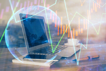 Forex market graph hologram and personal computer on background. Double exposure. Concept of investment.