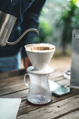 barista dripping coffee and slow coffee bar style