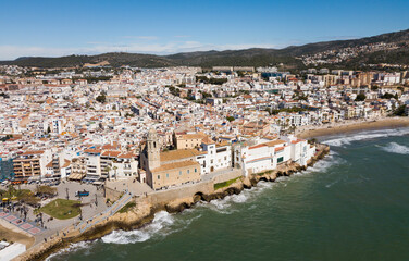Panorama of coastal city of Sitges with building of Monastery, Barcelona, Spain