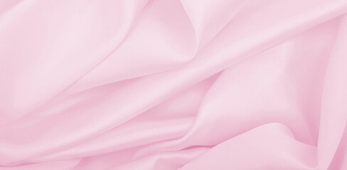 Smooth elegant pink silk or satin texture as wedding background. Luxurious background design