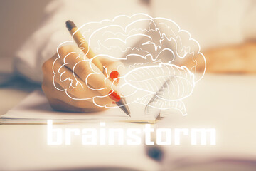 Start up creative drawing over close up hands in notepad background. Concept of brainstorming....