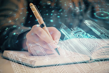 IOT drawing over writing hands in notepad background. Concept of smart home. Multi exposure