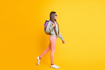 Fototapeta na wymiar Full length portrait of young person go carry backpack wear hoodie isolated on vibrant yellow color background