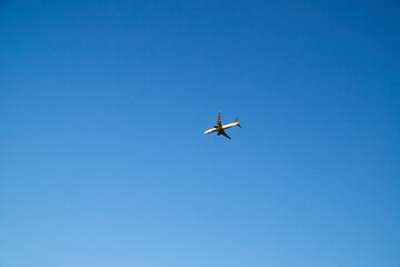 An airplane flying in the blue sky