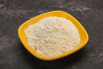 Wheat flour heap in the bowl