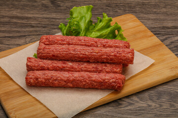 Raw beef sausages with spices