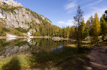 Autumn in the Dolomites, view of Federa lake surrounded by mountains