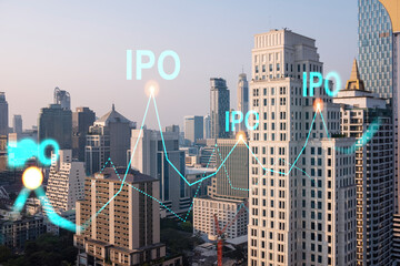 Hologram of IPO glowing icon, sunset panoramic city view of Bangkok. The financial hub for...