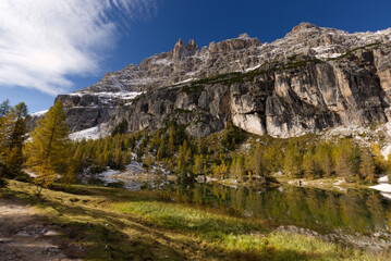 Autumn in the Dolomites, view of Federa lake surrounded by mountains