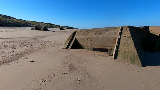 ruins of german bunker in the beach of Normandy, France