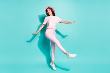 Obraz premium Full length body size view of her she nice attractive pretty lovely slim slender cheerful girl jumping dancing having fun isolated bright vivid shine vibrant green turquoise color background