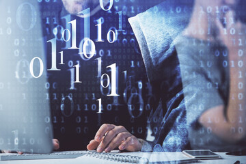 Multi exposure of data internet theme hologram with man working on computer on background. Concept...