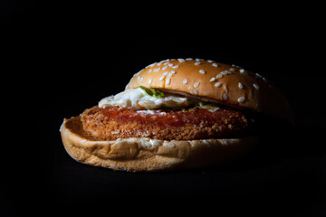 Close-up of tasty dinner. Burger isolated on the black