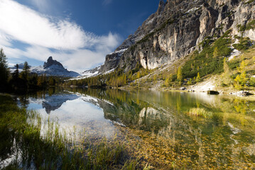 Autumn in the Dolomites, view of Federa lake surrounded by mountains