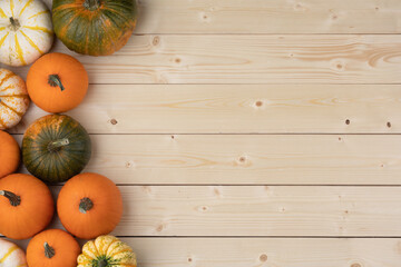 Pumpkins on wooden background