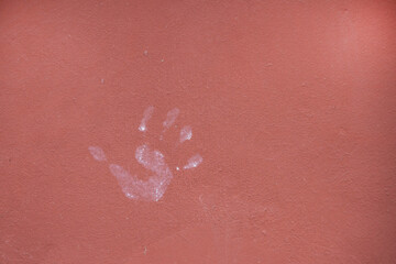 Fototapeta premium Palm print on a smooth painted wall.