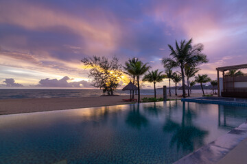 Beautiful sunset on the swimming pool with seaview