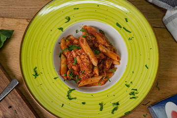 Canned Tuna tomato garlic parsley salad on a wooden table.Flat lay, selective focus