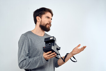 Fototapeta premium photographer with camera hobby technology studio lifestyle creative light background