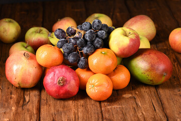 Naklejka na ściany i meble Fresh exotic fruits on the wooden table.