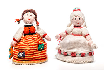 Knitted handmade dolls isolated on white background.