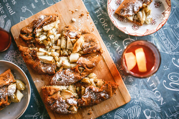 Apple pie, diet biscuit with apples and spices, top view. Autumn mood and pastries