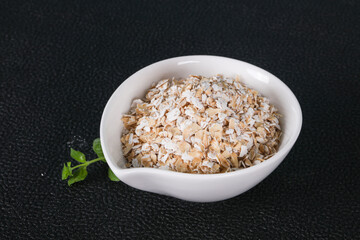 Raw oats in the bowl
