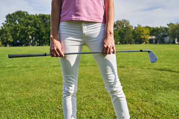 Female golfer standing on the golf course