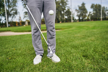 Professional Caucasian golfer perfecting his game technique