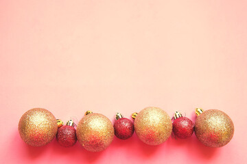 christmas bright pink and golden balls on a pink background with copy space - 386616887