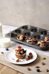mixed berry low carb Keto Diet muffin with almond and nut. set on cafe table.