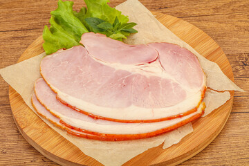 Sliced pork belly over board