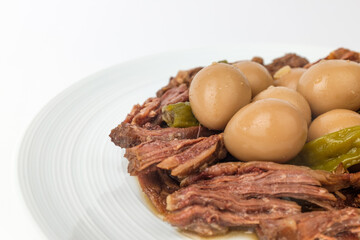 Stewed pork on a white background