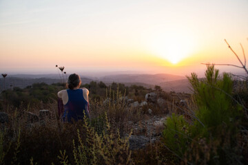 Fototapeta na wymiar People watching sunset at the Mountain of Winds, Ein Nataf, Jerusalem area.