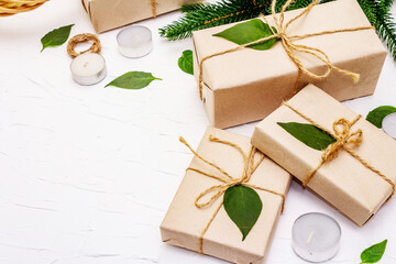 Fototapeta na wymiar Zero waste gift concept with craft boxes and evergreen branches