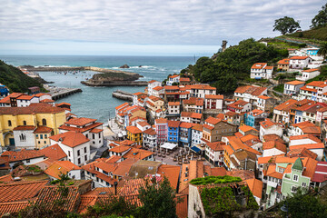 Naklejka na ściany i meble Old fishing village of Cudillero at the Cantabrian Sea coast in Asturias, Spain. Wide angle panoramic view of a picturesque fishing village.