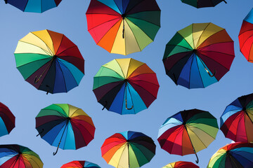 Colorful umbrellas in the sky background