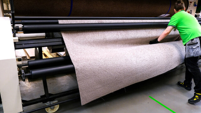 Modern carpet for textile design. The concept of industrial technology. Production automation. Textured background.