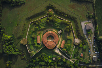 Aerial view of the fortress surrounded by vineyards. Fortified Austrian fort top view on the hill....