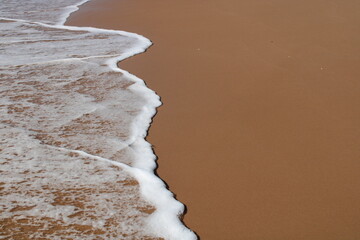 waves on the sand in a desert  beach