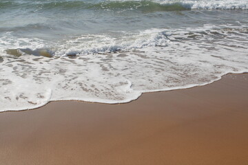 waves on the sand in a desert  beach