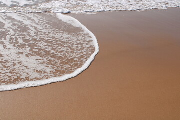 waves on the sand in a desert  beach