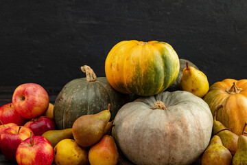 Harvest of pumpkins, apples and pears close up