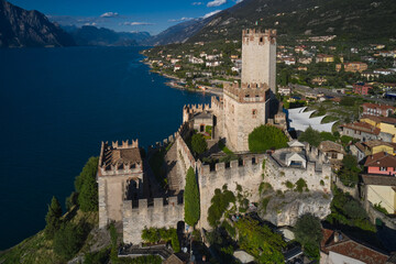 Obraz premium Italian resort on Lake Garda, Monte Baldo. Malcesine town, Lake Garda, Italy. Panoramic aerial view of Scaliger Castle in Malcesine, Malcesine town.