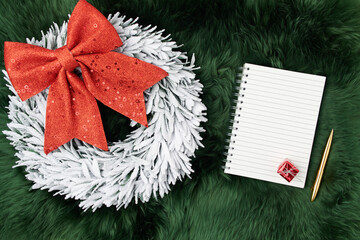 flat lay with wreath on green rug background