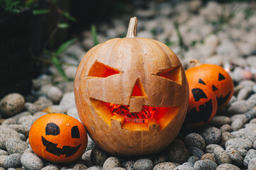 Halloween Jack-o-Lantern Pumpkins on stone stock photo